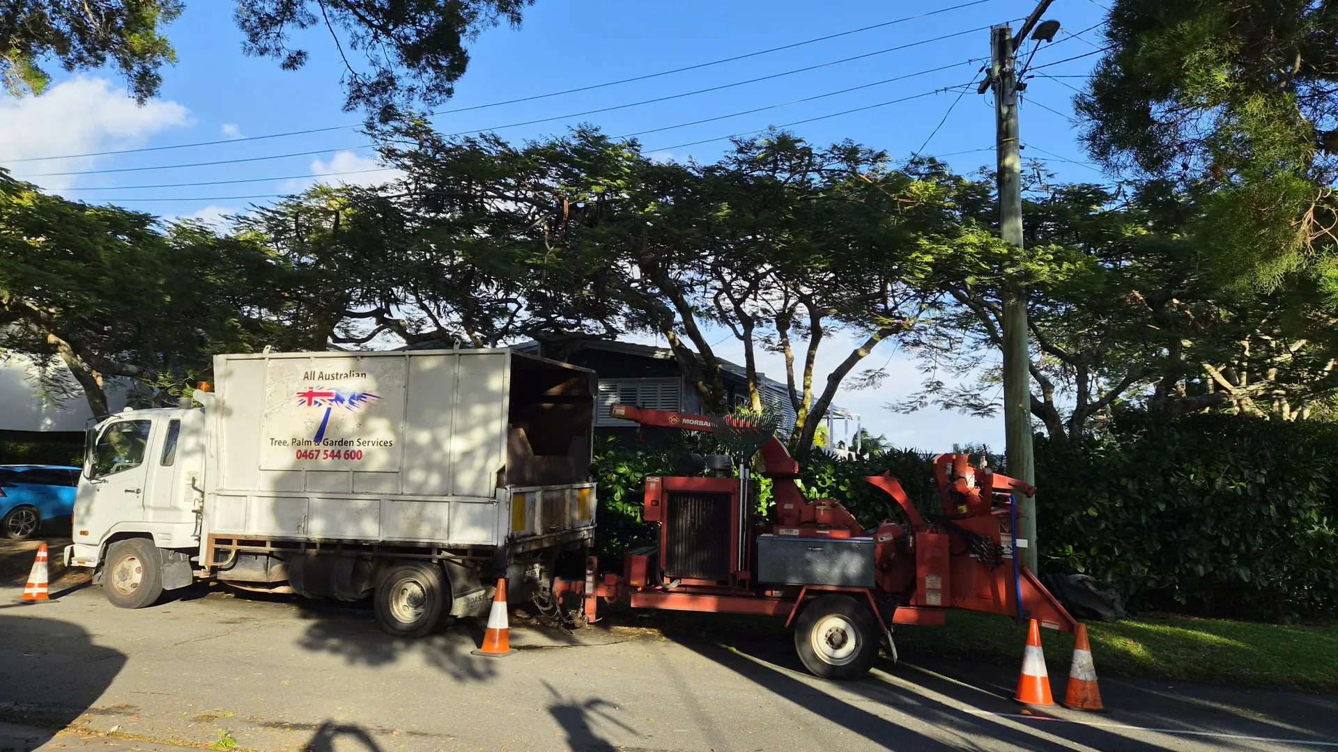 All Australian Tree Palm and Garden Services truck and chipper parked on a Sunshine Coast street ready for a job